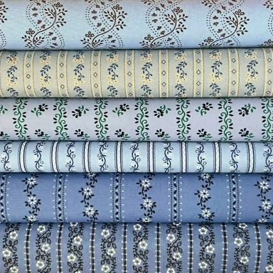 Hochwertige Trachtenstoffe und traditionelle Dirndlstoffe als Meterware blau, hellblau und dunkelblau im Chiemgauer Heimatwerk